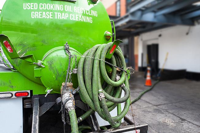 workers at Grease Trap Cleaning of Commerce City